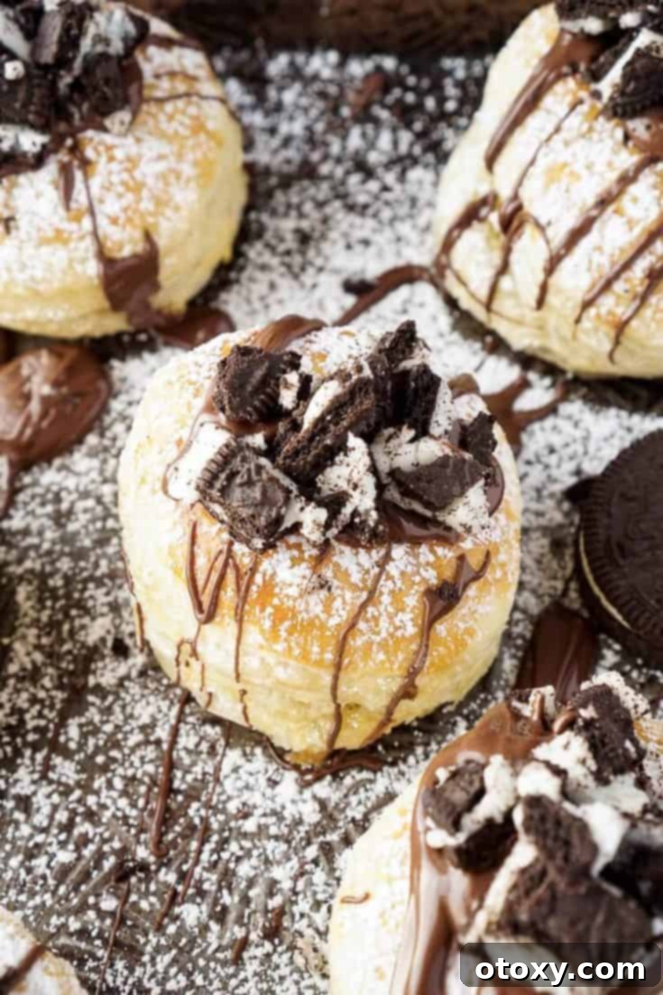 20 Effortless Puff Pastry Delights 20 The Croissookie, a hybrid dessert combining a croissant and a cookie, with a rich, dark filling.
