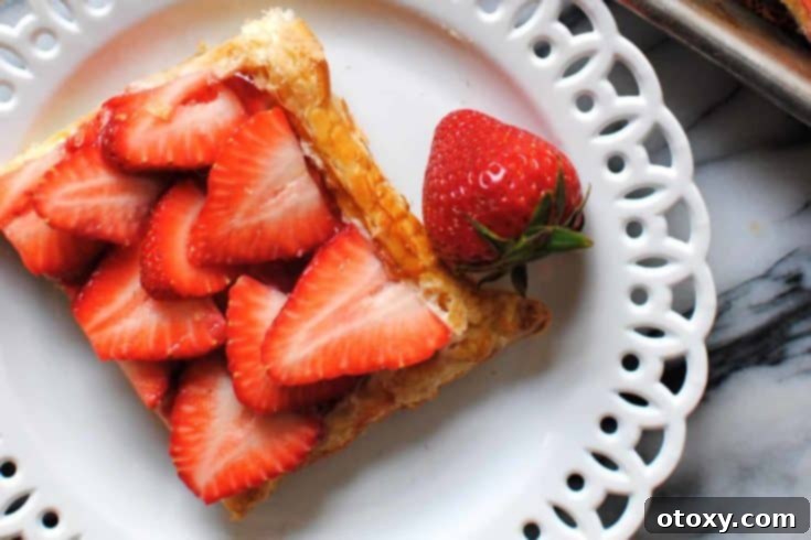 20 Effortless Puff Pastry Delights 21 A beautiful Easy Strawberry Puff Pastry Tart with fresh strawberries and a creamy mascarpone layer.