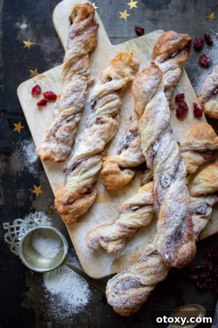 20 Effortless Puff Pastry Delights 8 Golden-brown cinnamon twists, sprinkled with cinnamon sugar, perfect for a sweet snack.