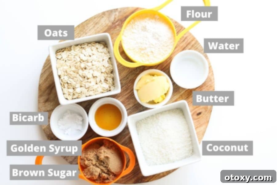 Anzac Golden Oat Bar 4 A collection of essential ingredients for making Anzac slice, including oats, flour, sugar, and golden syrup, artfully arranged on a wooden board.