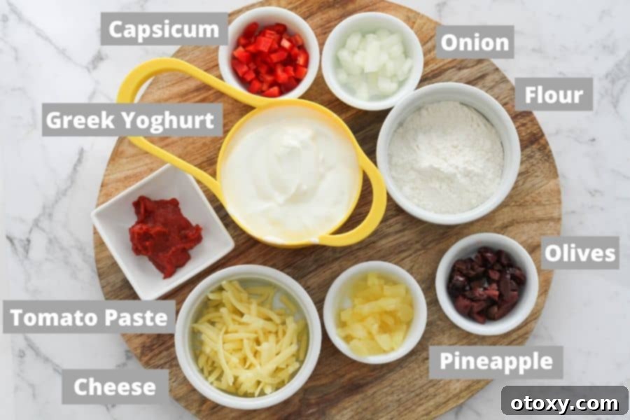 A selection of fresh pizza roll ingredients neatly arranged on a rustic wooden board.