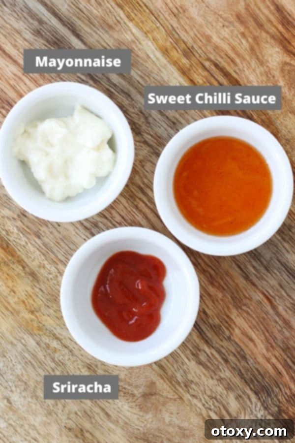 Flavor Burst Drizzle 3 Ingredients for Bang Bang Sauce laid out on a rustic wooden board.
