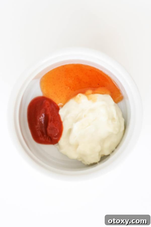 Flavor Burst Drizzle 4 Bang Bang Sauce ingredients expertly mixed in a small glass bowl.