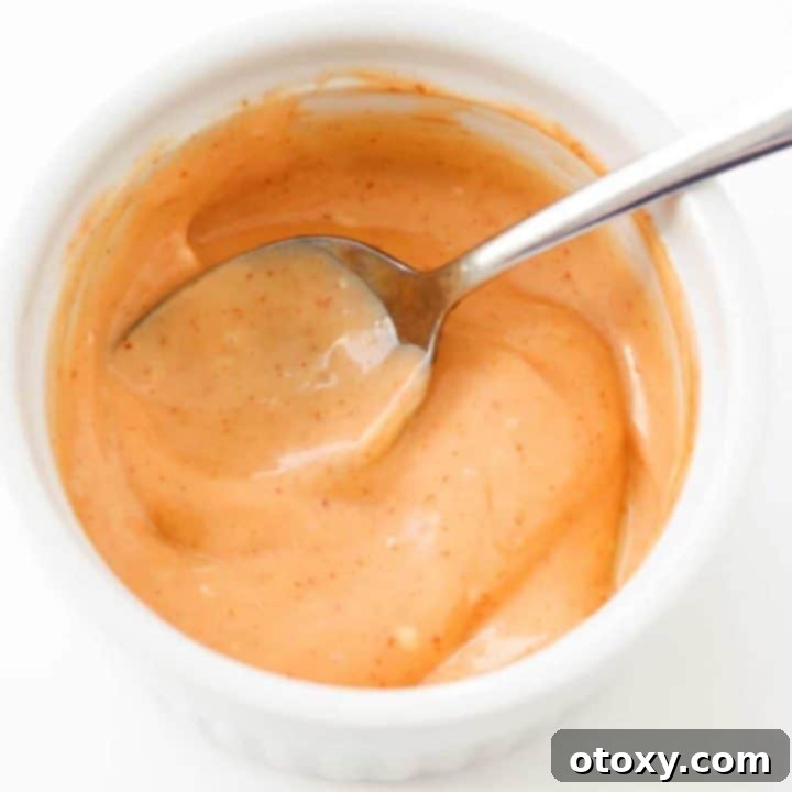 Flavor Burst Drizzle 7 A vibrant bowl of Bang Bang Sauce ready to be served.