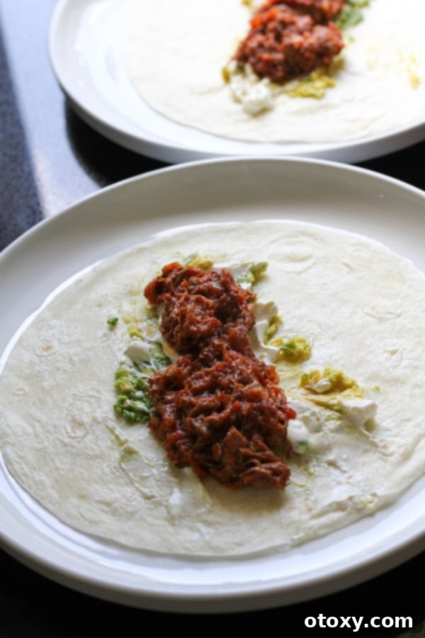 braised beef served on a warm tortilla with fresh cilantro and lime.