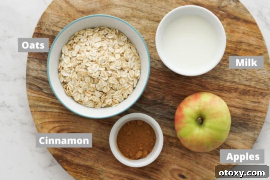 Harvest Apple Cinnamon Oats 4 A rustic wooden board showcasing the simple, wholesome ingredients required for making delightful apple cinnamon oatmeal, including an apple, cinnamon sticks, butter, and rolled oats.