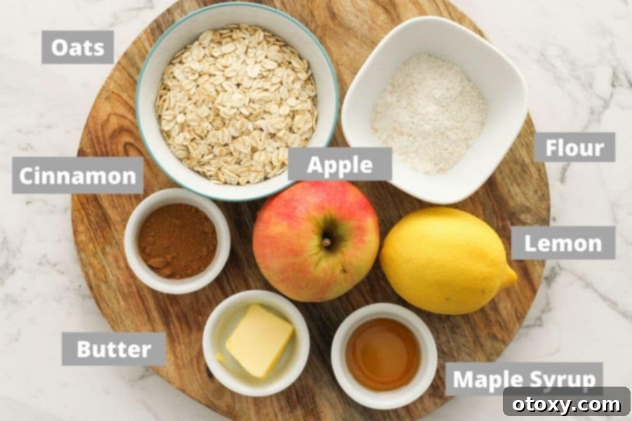 Selection of fresh ingredients for apple crisp laid out on a wooden board.