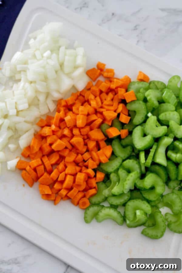 diced carrot, celery and onion on a chopping board