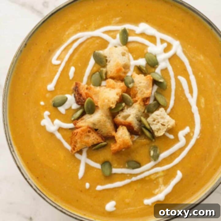 pumpkin soup topped with croutons, greek yoghurt and pumpkin seeds.
