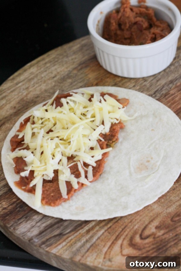 tortilla topped with beans and cheese.
