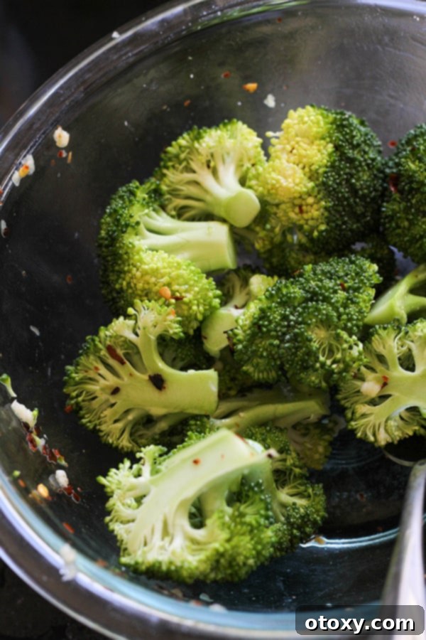broccoli florets in a glass bowl.