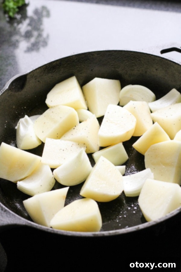 potatoes in a cast iron pan.