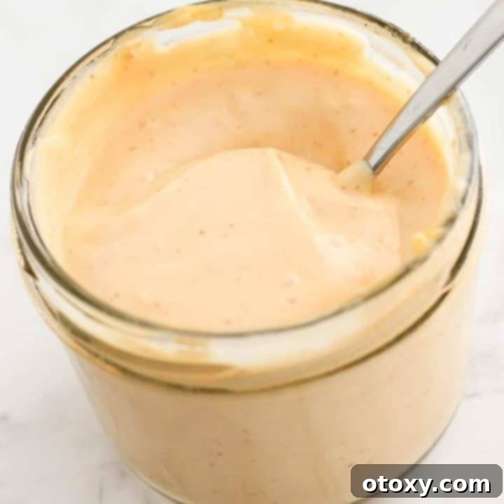 sriracha aioli in a glass jar.