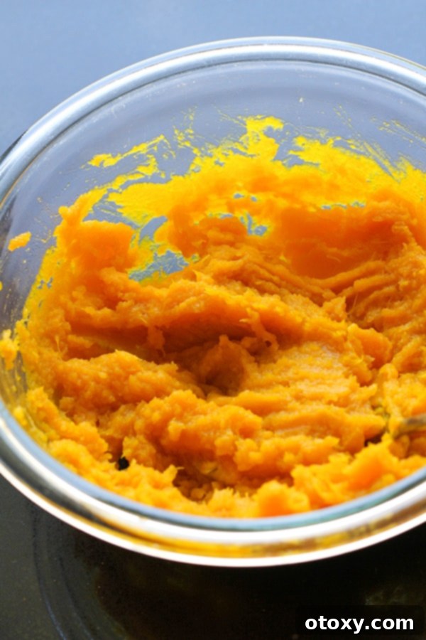 Golden Pumpkin Bites 6 mashed pumpkin in a glass bowl.