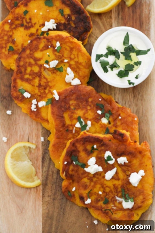 Golden Pumpkin Bites 10 pumpkin fritters laid on top of a wooden board.