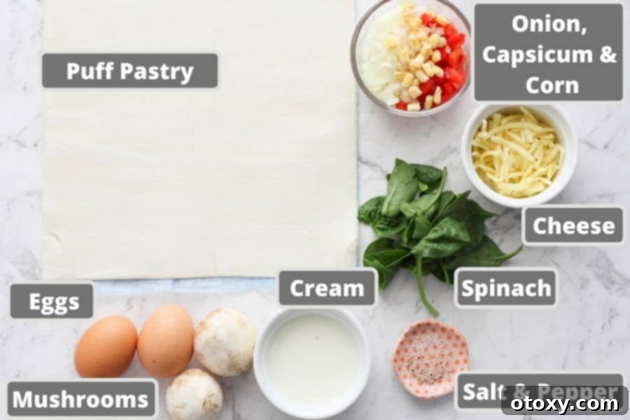 Essential ingredients for mini quiches laid out on a marble surface: frozen puff pastry, fresh eggs, heavy cream, and assorted vegetables.