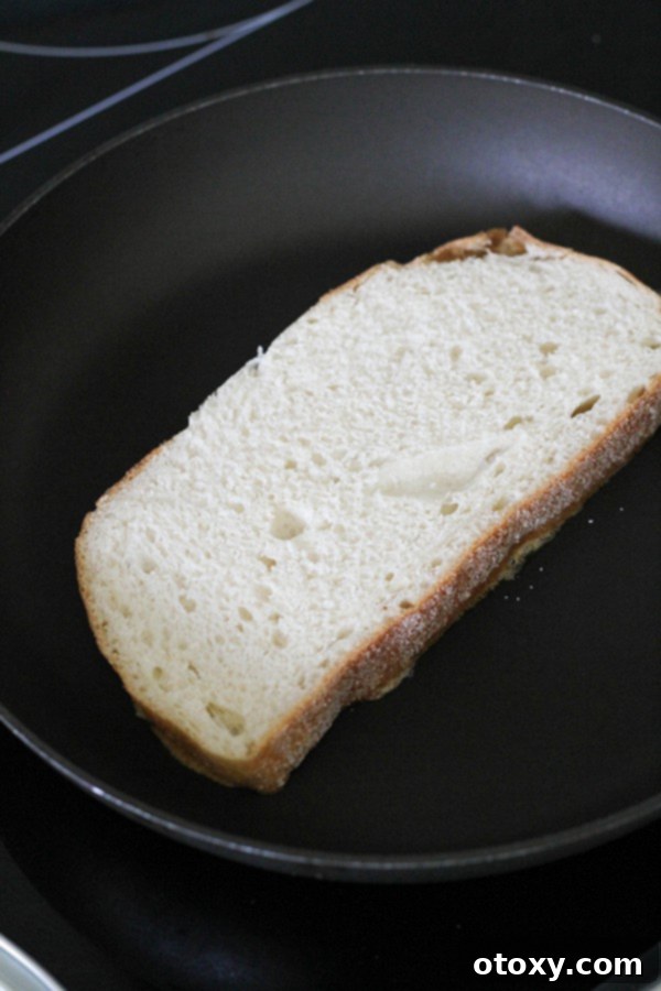 slice of bread in a skillet.