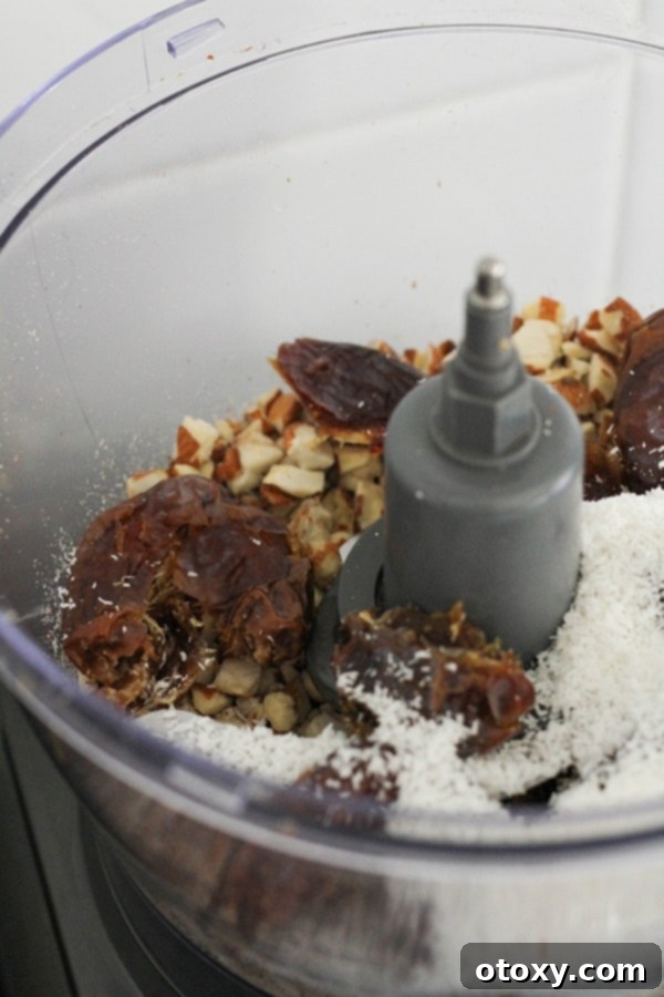 Tropical Date Energy Bites 6 All three ingredients – dates, almonds, and coconut – are now together in the food processor, ready to be blended.