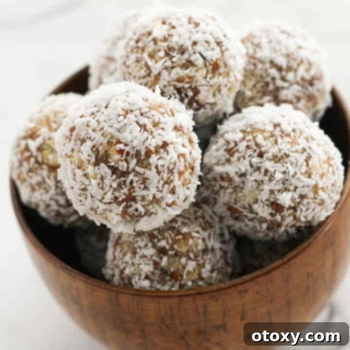 Tropical Date Energy Bites 10 Delicious and healthy date coconut energy balls in a rustic wooden bowl, perfectly coated.