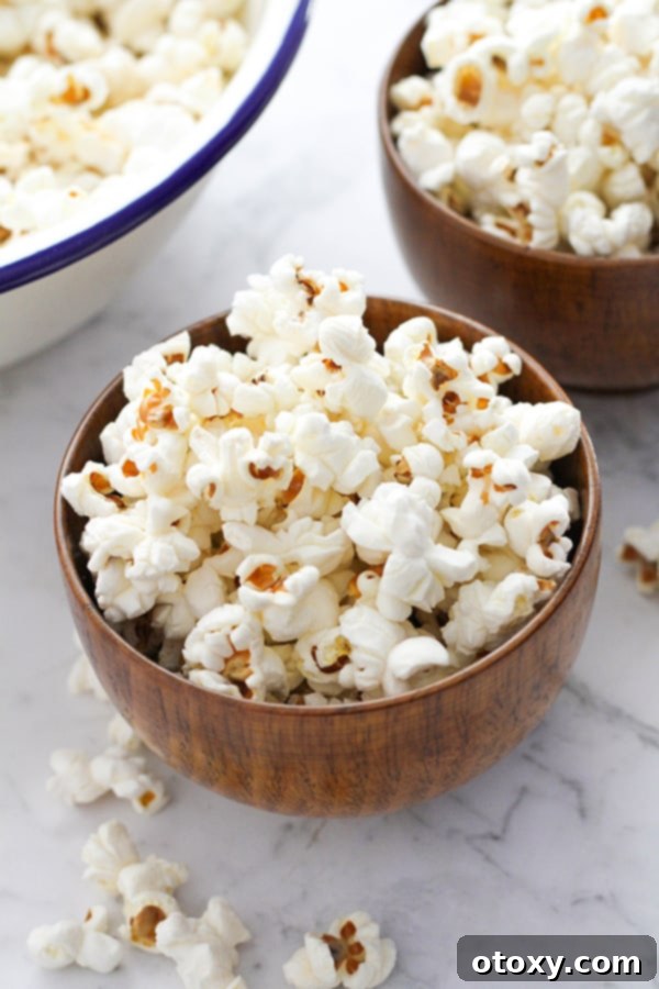 Popcorn in a beautiful wooden bowl, ready to be enjoyed.