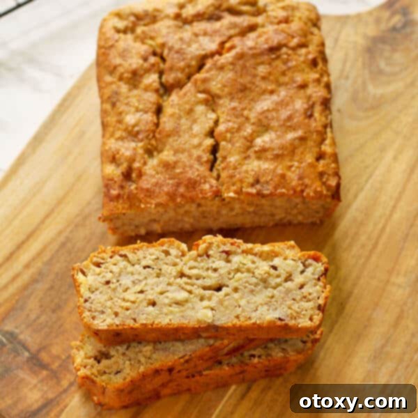 stacked slices of healthy banana bread with the loaf in the background