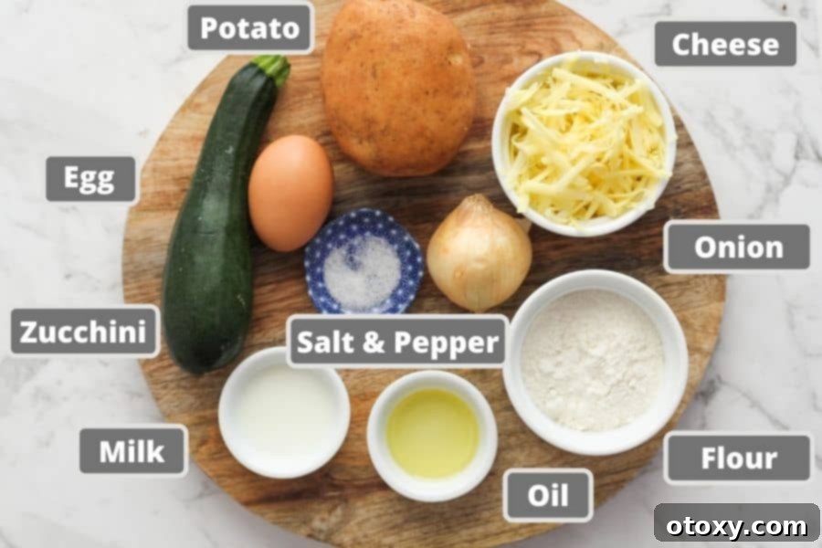 A rustic wooden board displays all the fresh ingredients needed for potato fritters: whole potatoes, a green zucchini, onion, a brown egg, a block of cheddar cheese, and a glass of milk.