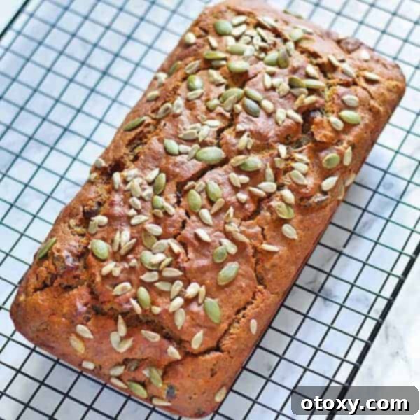 Wholesome Date Bread 2 A freshly baked healthy date loaf cooling on a wire rack, showcasing its golden-brown crust and inviting texture.