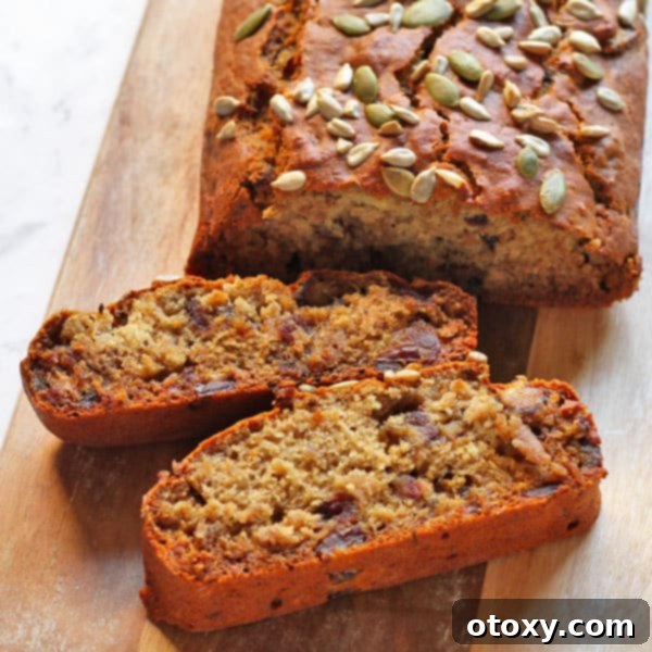 Wholesome Date Bread 4 A slice of healthy date loaf artfully arranged, ready to be enjoyed with a hot beverage.
