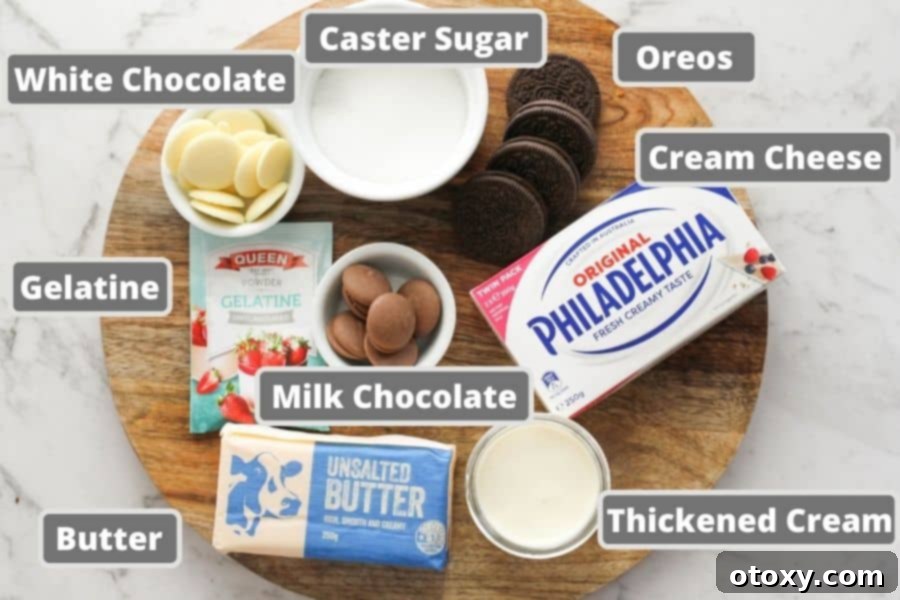 Various cheesecake ingredients laid out, including blocks of cream cheese, butter, different types of chocolate, and a bowl of caster sugar.