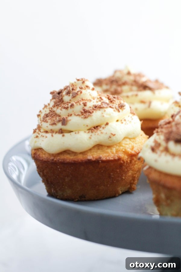 white chocolate mud cupcakes on a cake stand.