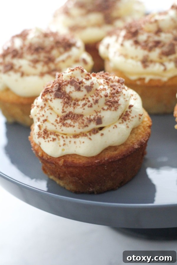 white chocolate mud cupcakes on a cake stand.