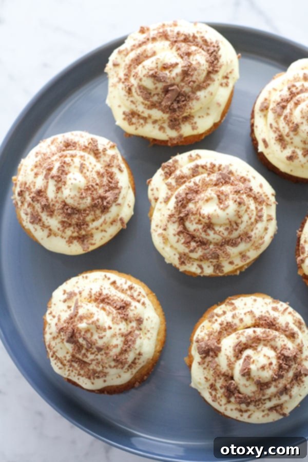 white chocolate mud cupcakes on a cake stand.