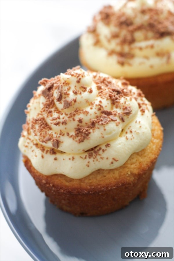 white chocolate mud cupcakes on a cake stand.