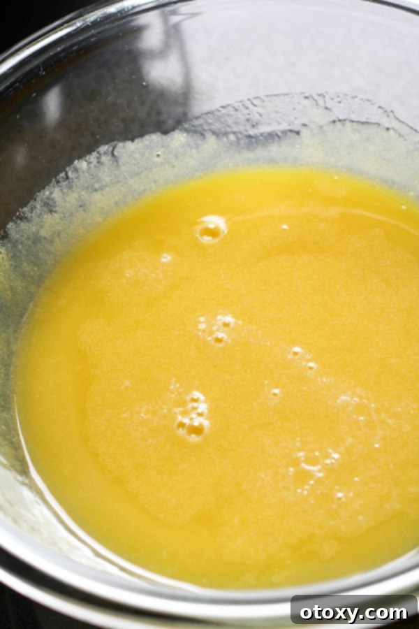 butter, chocolate and sugar melted in a glass bowl.