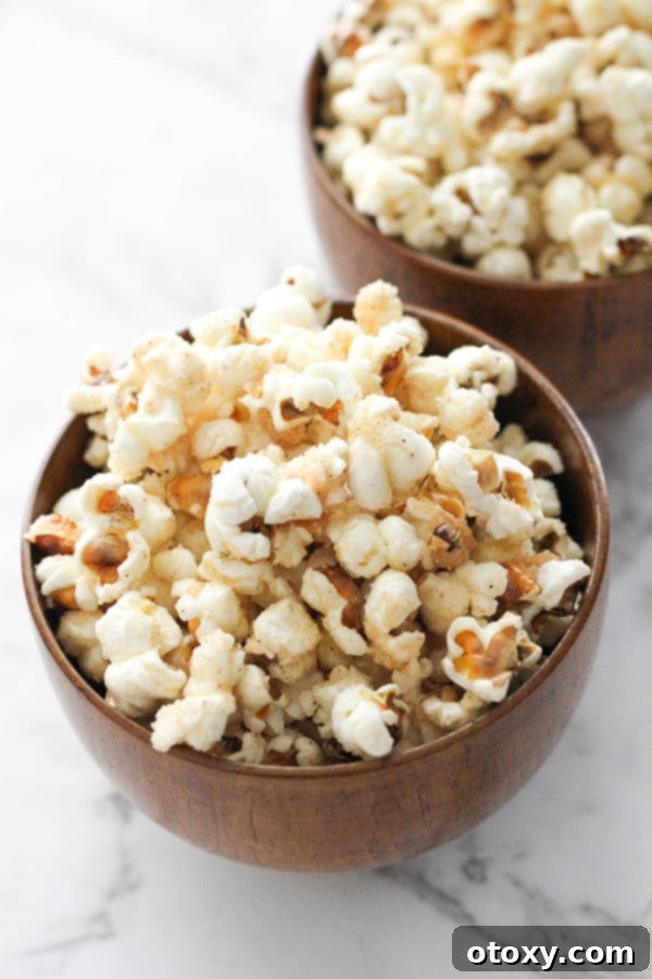 Freshly made cinnamon sugar popcorn in stylish wooden bowls, ready for sharing.