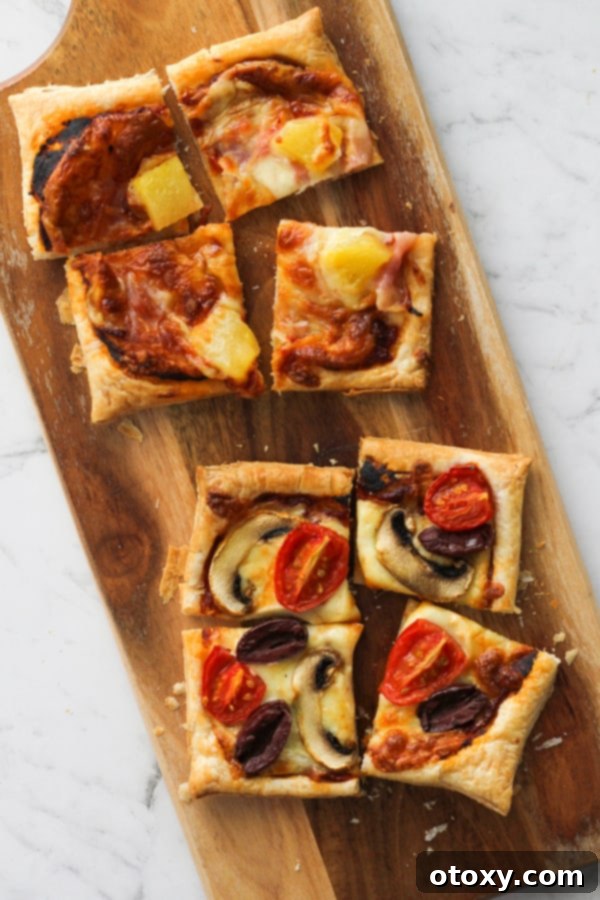 Sliced puff pastry pizzas on a serving board, ready to be enjoyed.