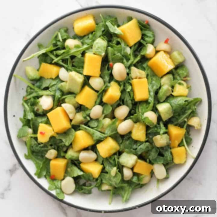 Fresh Mango Avocado Salad in a white bowl, ready to serve.