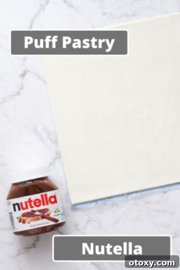 Chocolate Nutella Swirl Pastries Baked or Air Fried 4 three ingredients for chocolate pinwheels: a sheet of puff pastry, a jar of Nutella, and a bowl of icing sugar.