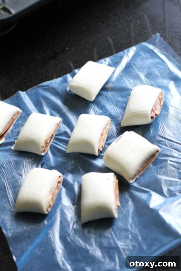 Chocolate Nutella Swirl Pastries Baked or Air Fried 6 the rolled puff pastry log sliced into 8 even, swirl-shaped pieces.