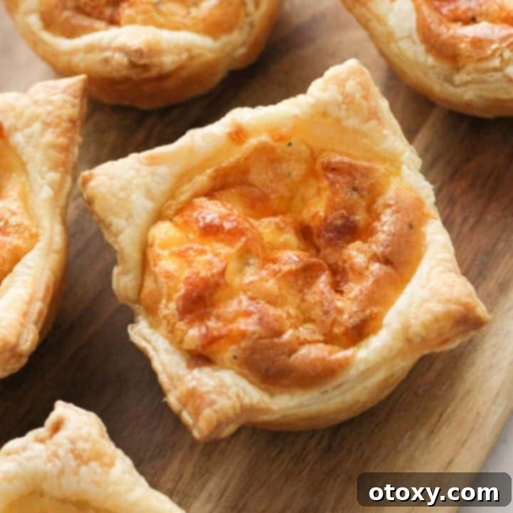 Delicious mini quiches on a wooden board, ready to serve.