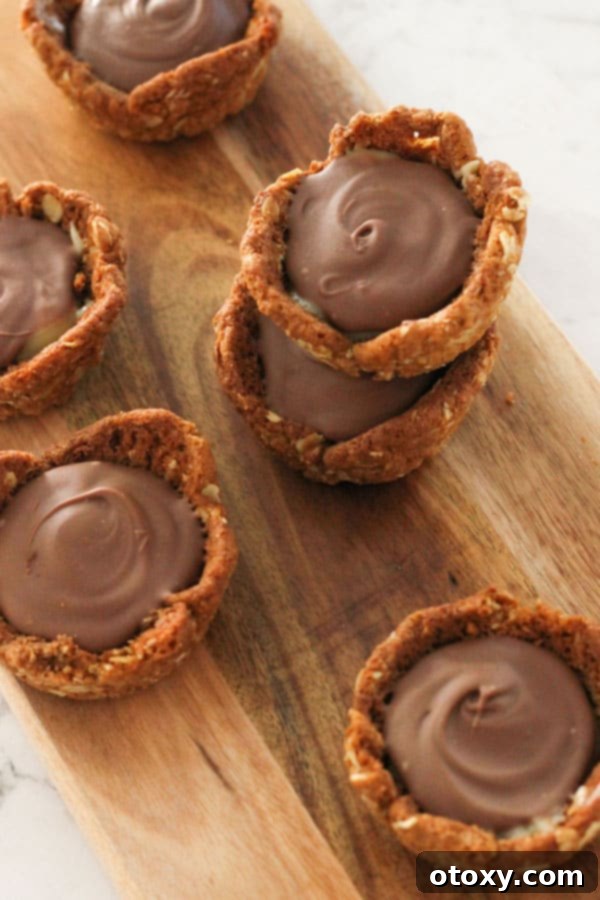 Luscious Caramel Tartlets 3 caramel tarts on a wooden board.