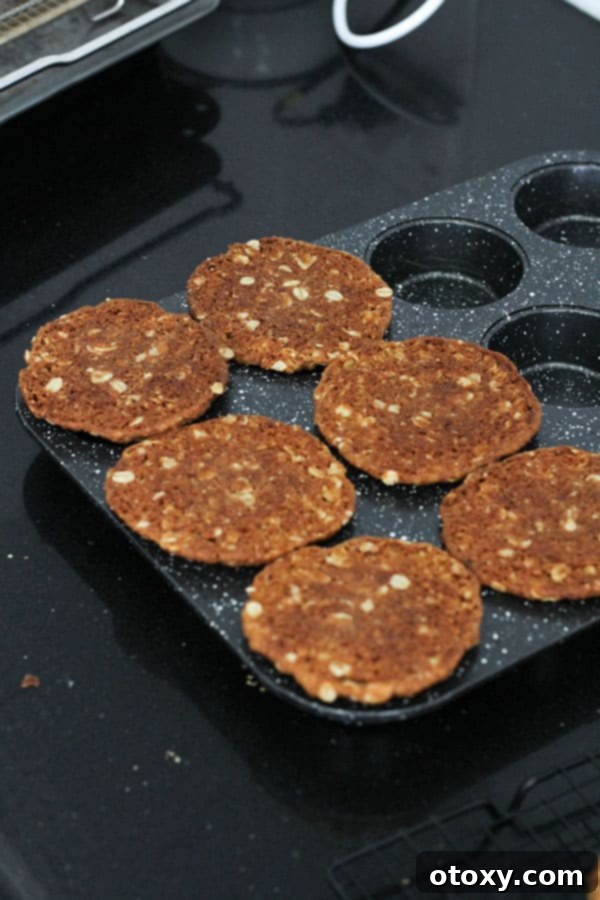 Luscious Caramel Tartlets 4 biscuits laying on top of a muffin tin.