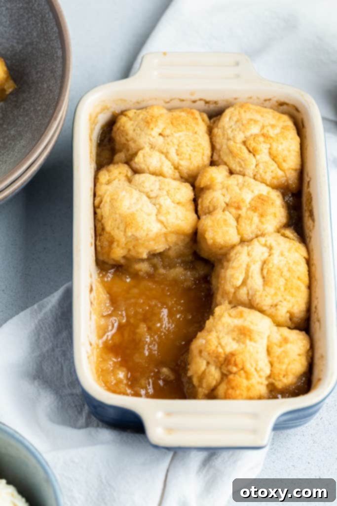 golden syrup dumplings in a baking dish.
