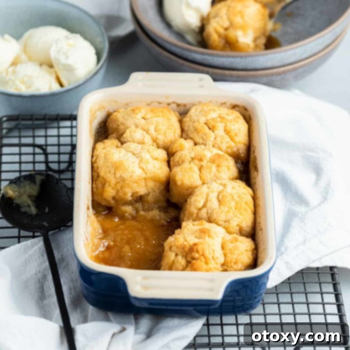 golden syrup dumplings in a baking dish on top of a wire tray.
