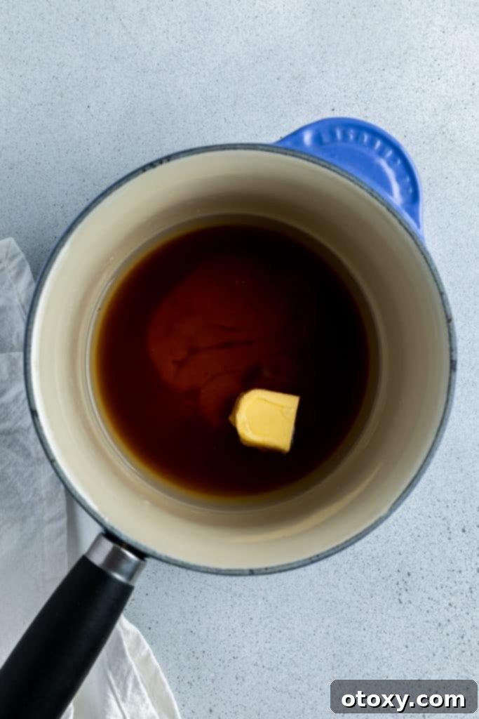 syrup being cooked in a saucepan.