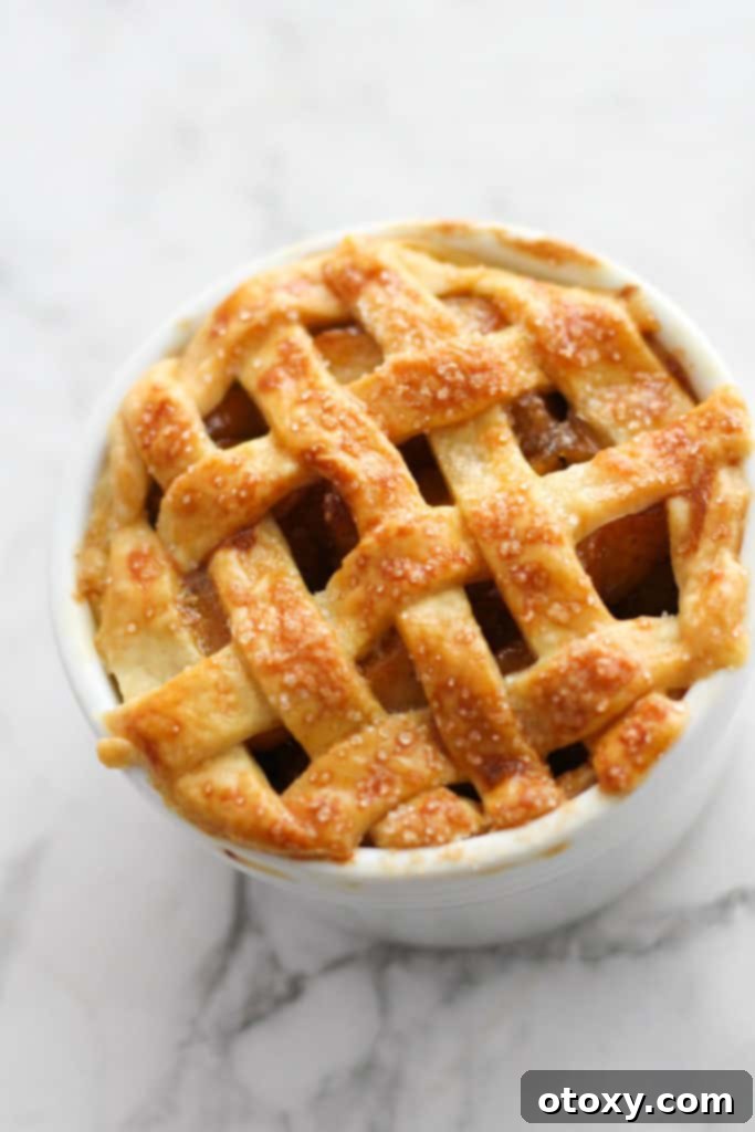 mini apple pie in a white ramekin.