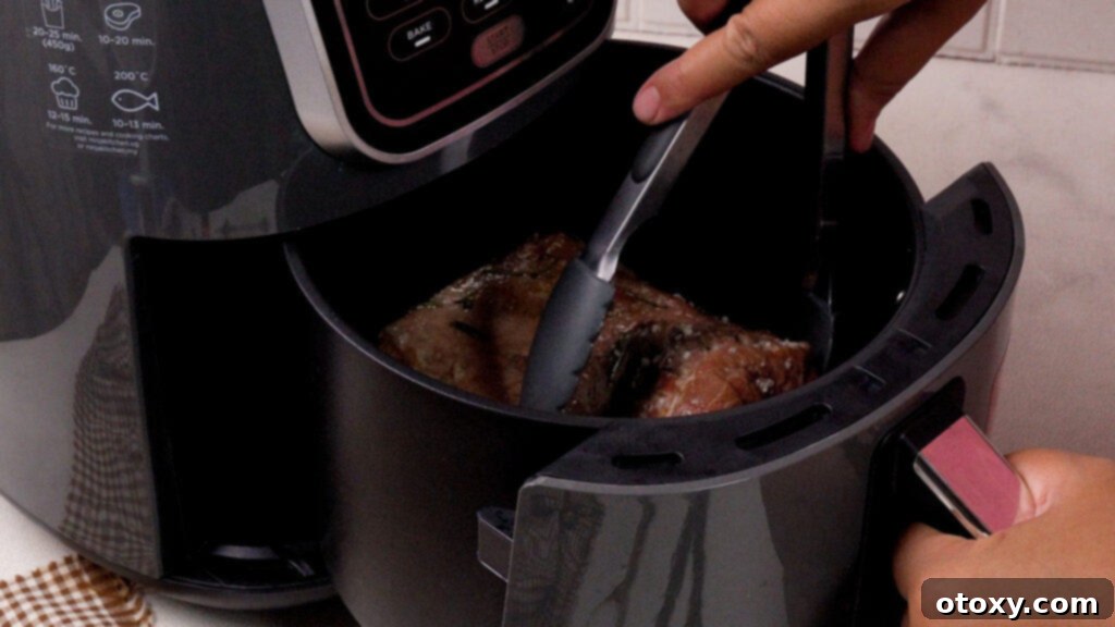 Perfect Air Fryer Roast Beef 12 Flipping the beef halfway