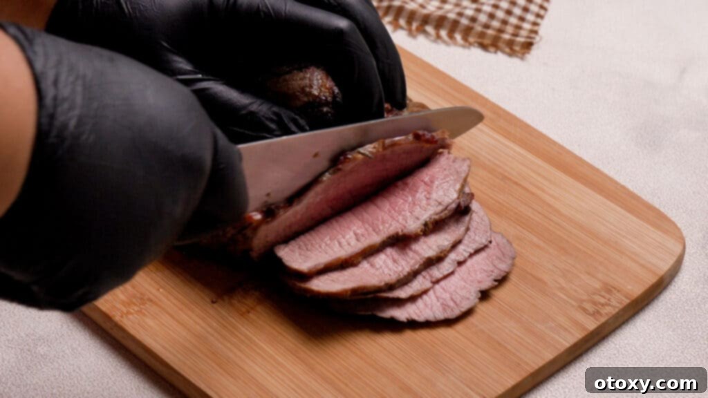 Perfect Air Fryer Roast Beef 4 Cutting the roast beef
