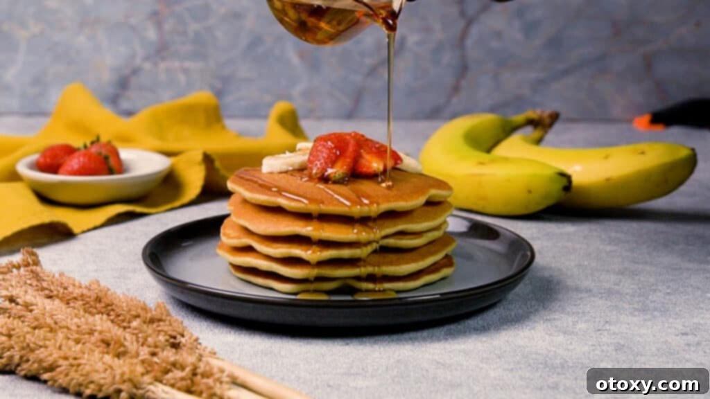 Ultimate 40g Protein Pancakes 11 Protein pancakes topped with maple syrup