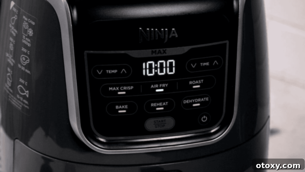 Crispy Chicken Delights 15 Golden-brown, crispy chicken fritters cooking in an air fryer basket, with the lid open.